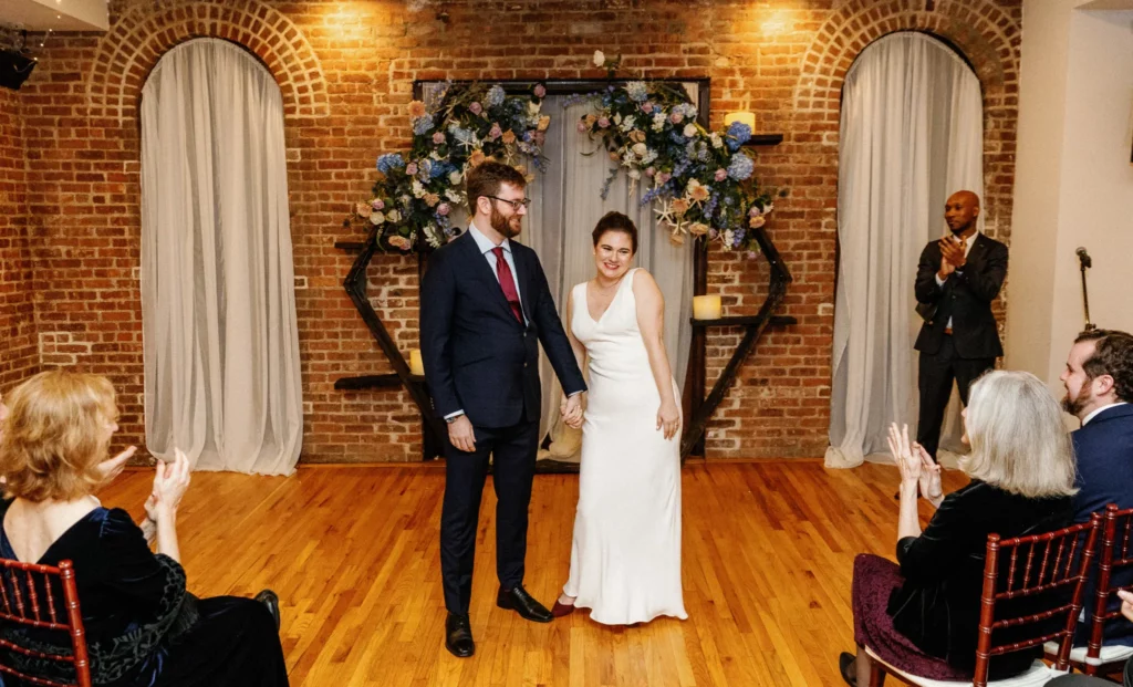 Katie and Zachary at the alter getting married