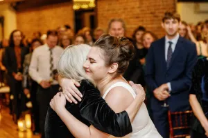 Katie hugging a family member
