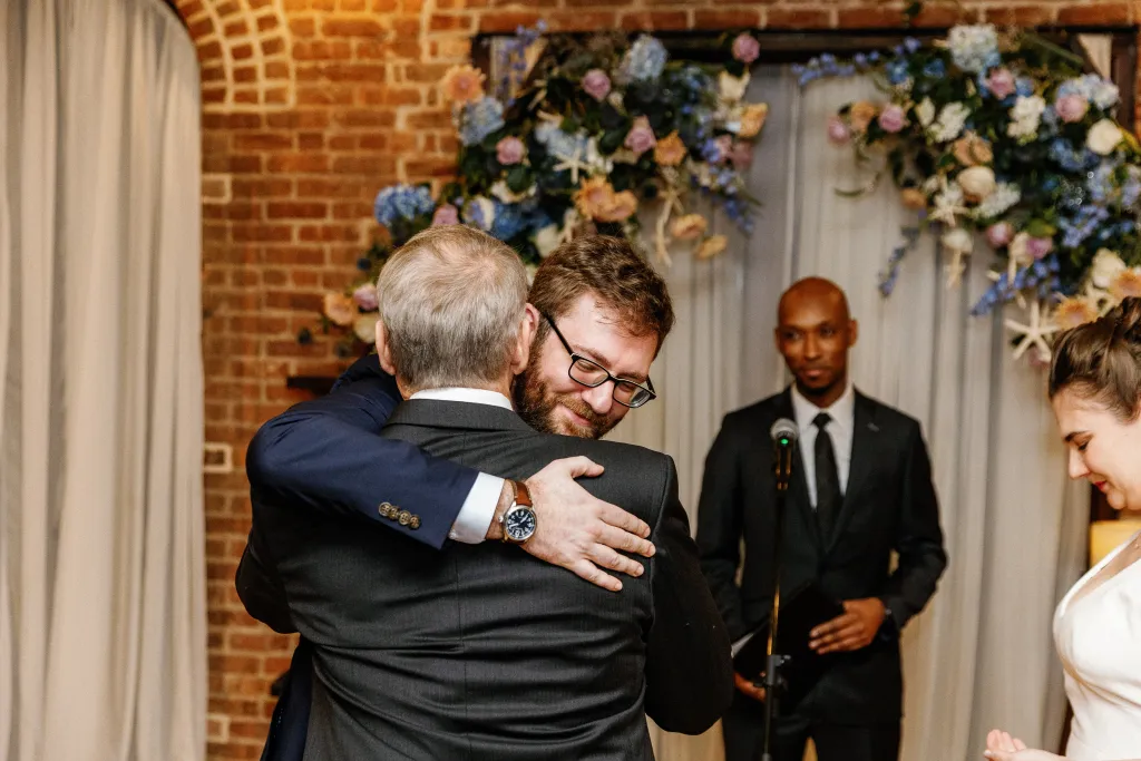 Zachary hugging family