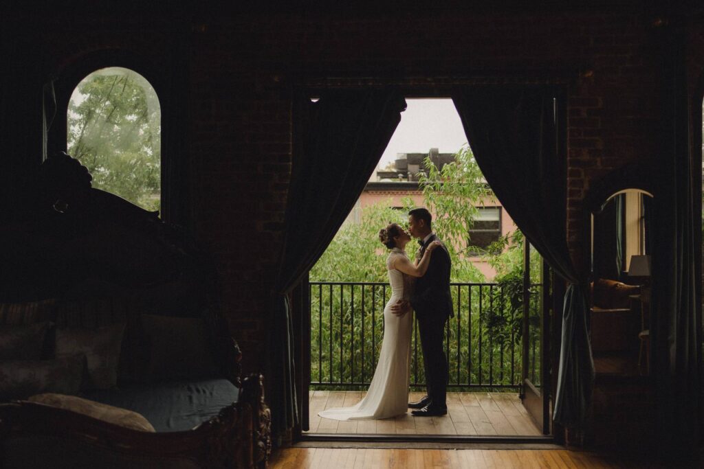 Bride and groom on balcony at Deity Brooklyn wedding venue